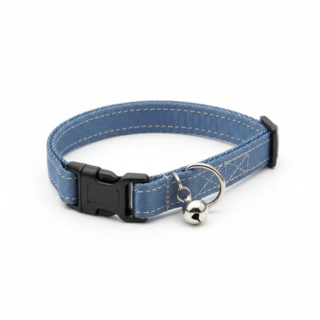 Close-up of breakaway buckle and bell ring on a cat collar