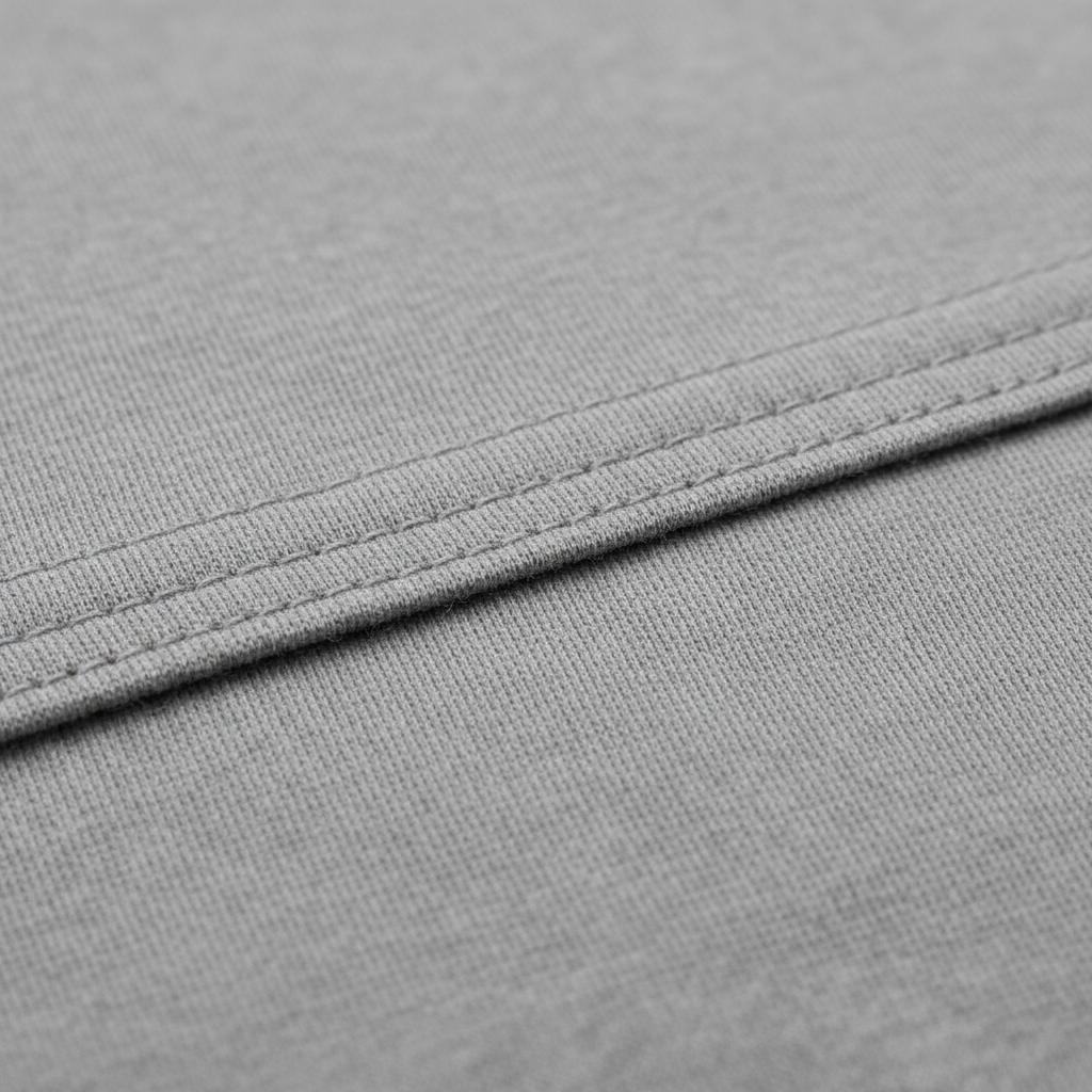 High-quality men’s T-shirt fabric close-up showing knit texture and stitching