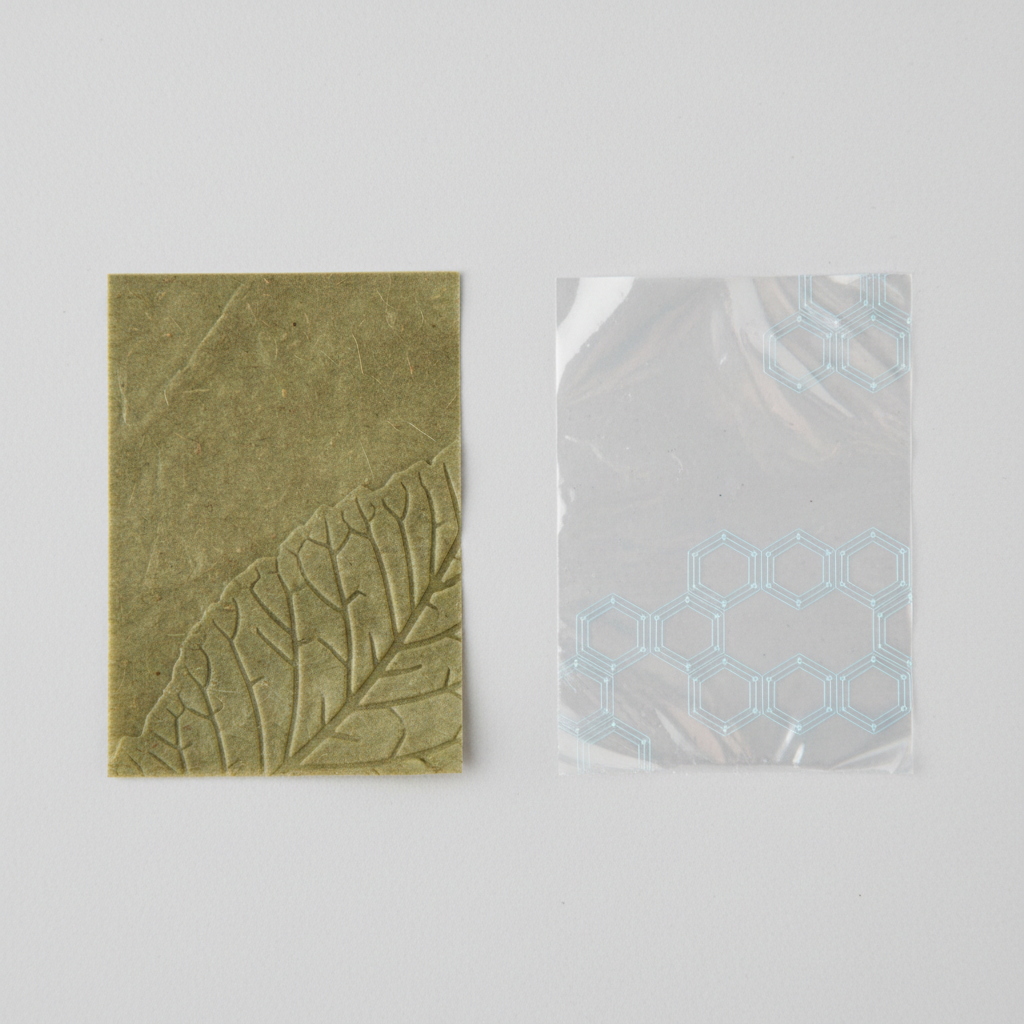 Comparison of compostable and regular car trash bag materials close up