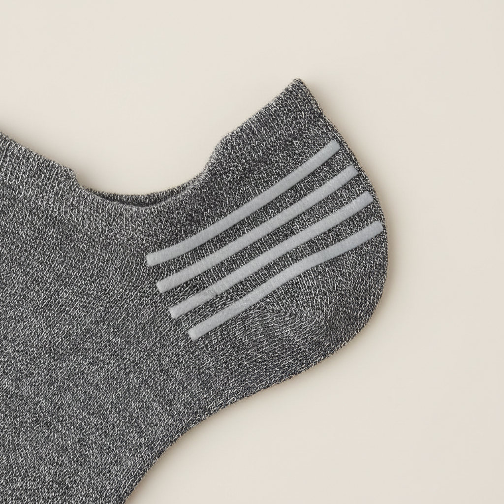 Close-up of silicone heel grips on men no show socks to prevent slipping